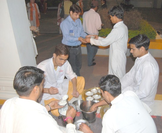 The Temple Priests distribute Prasadam to everybody